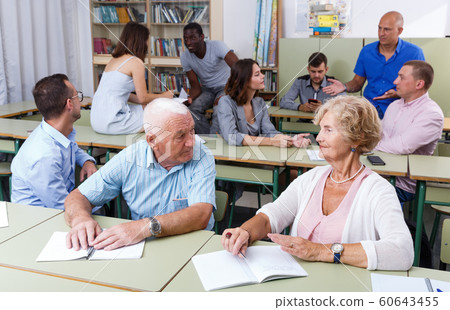 Elderly man and woman talking during exam Elderly man and woman talking during exam 60643455