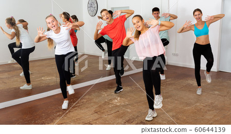 Teenage boys and girls dancing group choreography Teenage boys and girls dancing group choreography 60644139