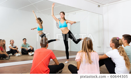 Female dance teacher giving dance class for teens Female dance teacher giving dance class for teens 60644305