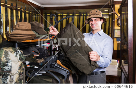 Man buying hunt clothes 60644616