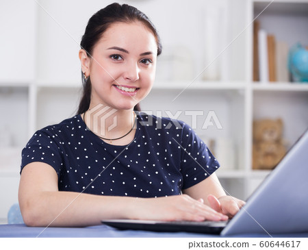 Attractive female on laptop Attractive female on laptop 60644617