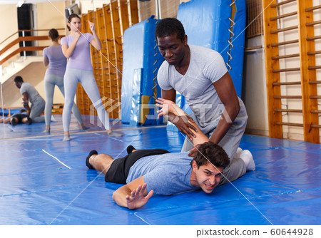 Two Men Practicing Self Defense Techniques Stock Photo