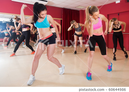 Young fitness females dancing modern zumba Young fitness females dancing modern zumba 60644986