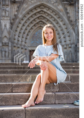 Girl sitting on stairs of temple 60644992
