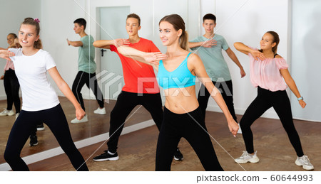 Teenage dancers practicing active vigorous dance in modern studi 60644993