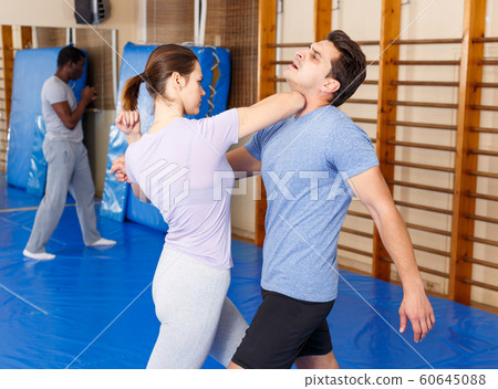 People practicing self defense techniques People practicing self defense techniques 60645088