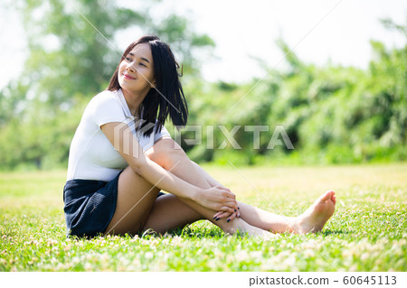 Young teenager girl resting in summer park Young teenager girl resting in summer park 60645113