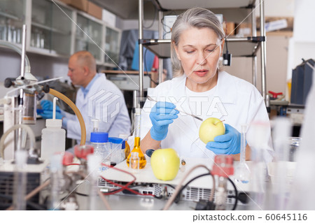 Female scientist checking agricultural products 60645116