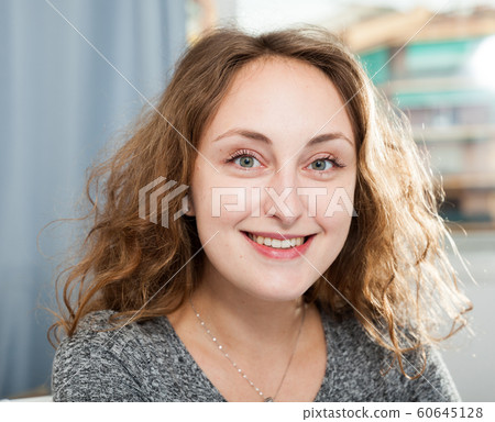 Happy woman at home 60645128