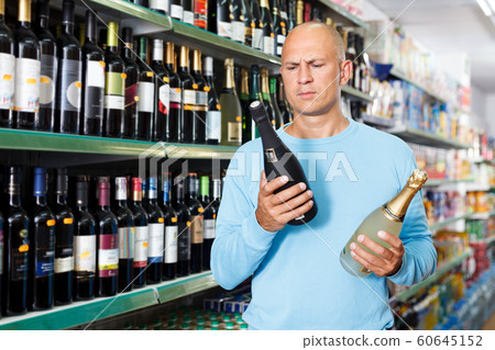man choosing wine man choosing wine 60645152