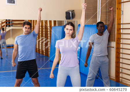People warming up at gym People warming up at gym 60645270