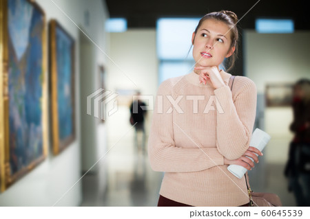 Woman at exhibition in museum 60645539