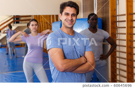 Smiling man posing in fitness club Smiling man posing in fitness club 60645696