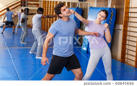 People practicing self defense techniques People practicing self defense techniques 60645698