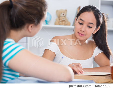 Teenagers girls studying at home Teenagers girls studying at home 60645699