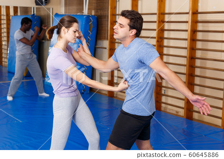 People Practicing Self Defense Techniques Stock Photo