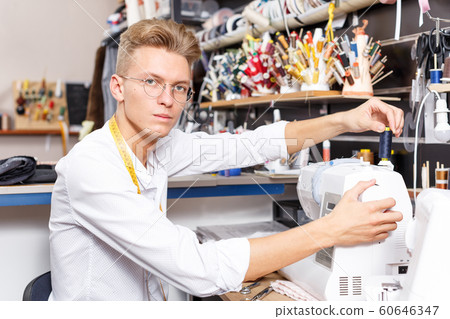 Tailor working with sewing machine Tailor working with sewing machine 60646347