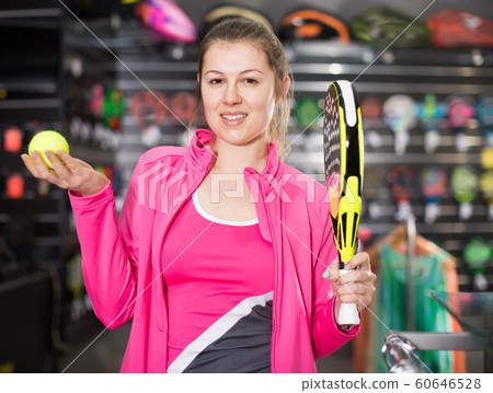 Sporty woman in uniform is holding rocket Sporty woman in uniform is holding rocket 60646528