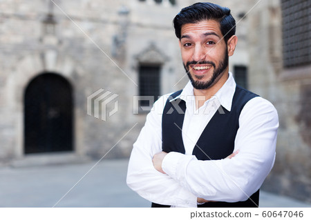 Smiling man with crossed arms Smiling man with crossed arms 60647046