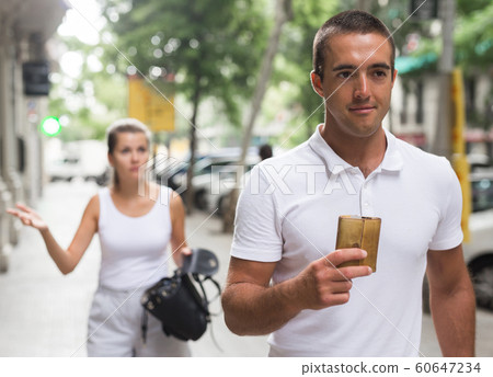 Male thief stealing girl purse Male thief stealing girl purse 60647234