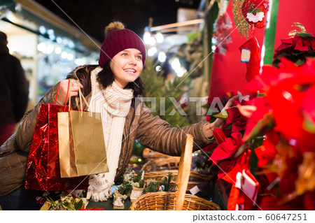 Nice teen girl with floral decorations 60647251