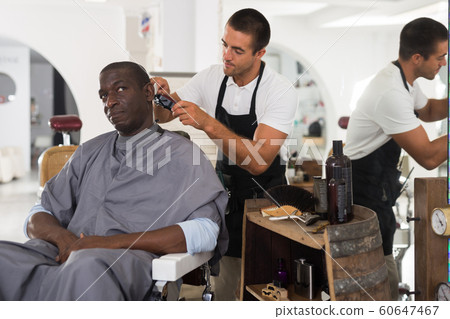 African male client getting haircut 60647467