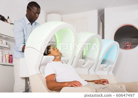 African American hairdresser and young client 60647497