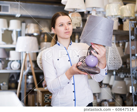 woman is buying lamp 60647514