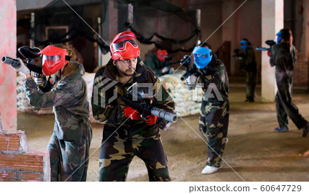 Players of red team are ready for attack on battlefield. Players of red team are ready for attack on battlefield. 60647729