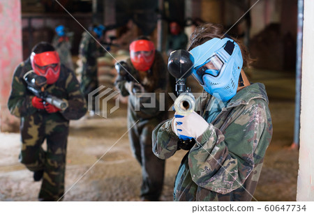 Man of blue team who is targeting in enemies while they are attacking in battlefield Man of blue team who is targeting in enemies while they are attacking in battlefield 60647734