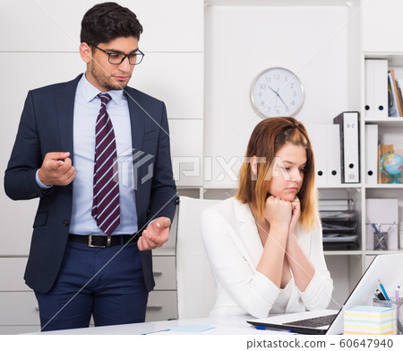 Businessman angry to female coworker Businessman angry to female coworker 60647940
