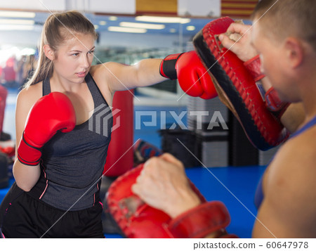Woman boxer is training 60647978