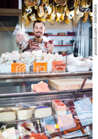 Seller offering displayed sorts of meat 60648669