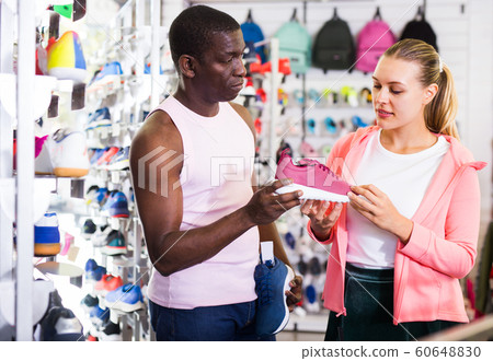 Nice couple choosing sports shoes 60648830
