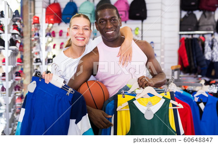 Woman and man in sporting goods store Woman and man in sporting goods store 60648847