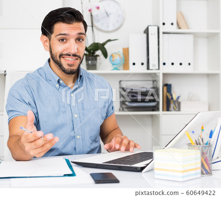Spanish businessman is talking with partner about contract Spanish businessman is talking with partner about contract 60649422