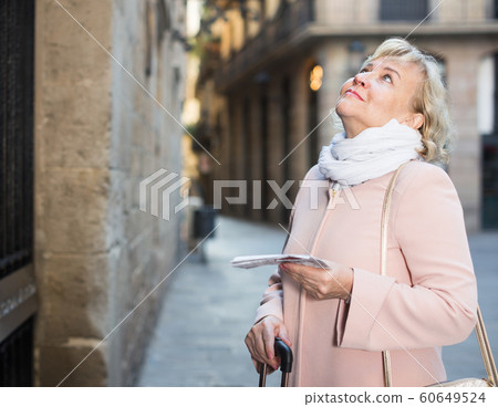 adult woman holding map guide 60649524