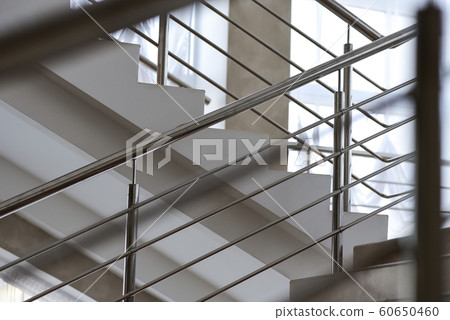 Staircase in a building with metal railing Staircase in a building with metal railing 60650460