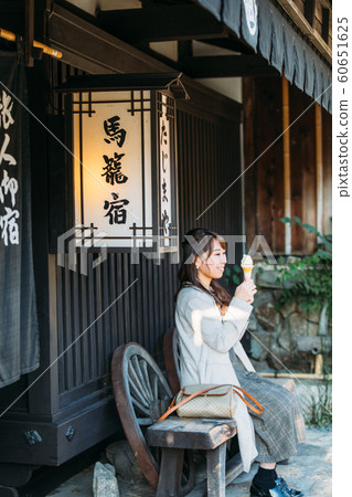 Magome woman eating around Magome woman eating around 60651625