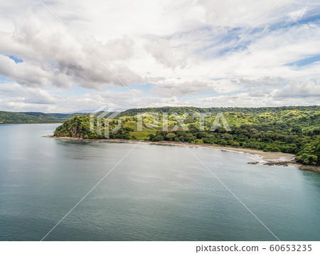Aerial shot of the tropical beach Playa Arenillas in Costa Rica in peninsula Papagayo coast in guanacaste Aerial shot of the tropical beach Playa Arenillas in Costa Rica in peninsula Papagayo coast in guanacaste 60653235