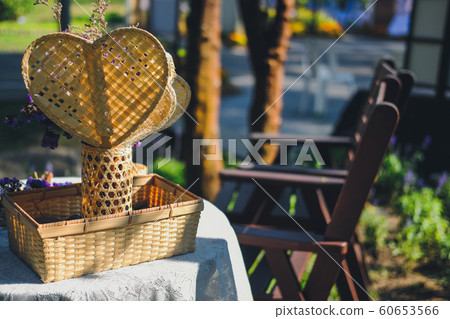 wicker basket decorating on table in garden wicker basket decorating on table in garden 60653566