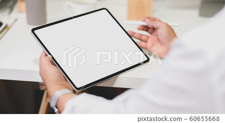 Cropped shot of  businessman working on his Cropped shot of  businessman working on his 60655668