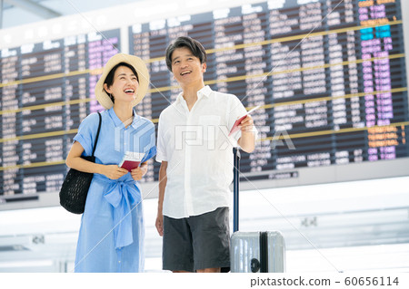 Travel airport couple married couple overseas travel passport Travel airport couple married couple overseas travel passport 60656114
