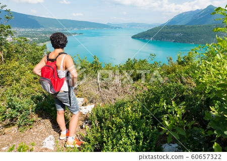 woman watching view of Lake Annecy woman watching view of Lake Annecy 60657322