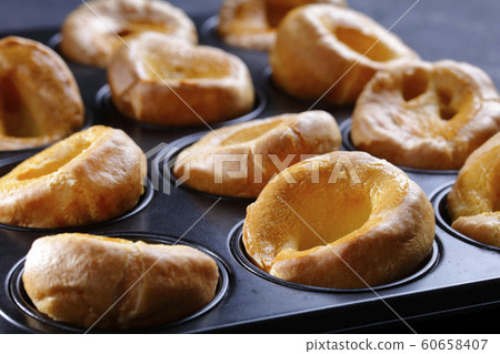 Yorkshire puddings in a metal baking tray 60658407