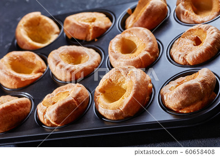 close-up of Yorkshire puddings in a baking tray 60658408