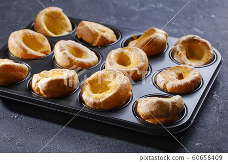 close-up of Yorkshire puddings in a baking tray 60658409