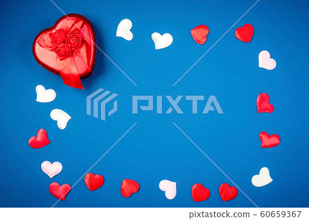 Red heart with a gift for Valentine's Day 60659367