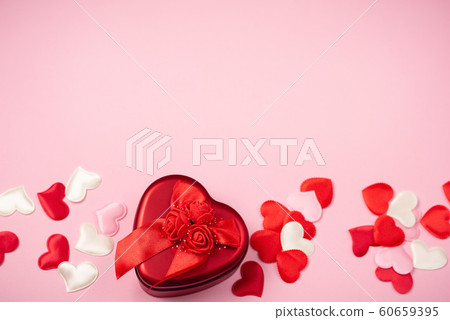 Red hearts with a gift for Valentine's Day Red hearts with a gift for Valentine's Day 60659395