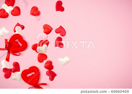 Red hearts for Valentine's day on a beautiful pink background. 60660409